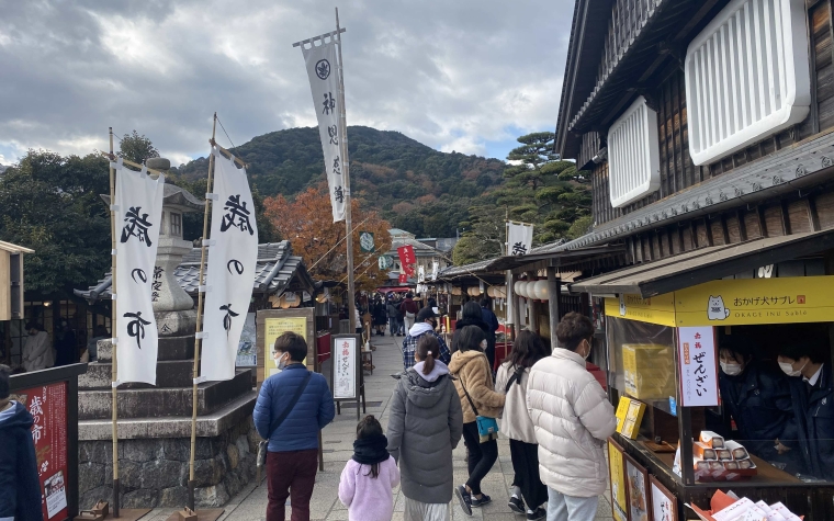 Tourists outside a store in the Okage-yokocho in front of the Ise Jingu in Mie prefecture, Japan